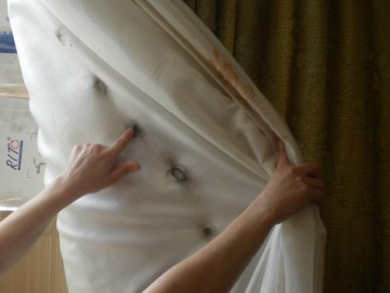 Curtains set on fire by teargas that is regularly shot inside the houses of Nabi Saleh