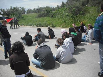 Peaceful sit-in by human rights activist during one of the protest in the village of Nabi Saleh